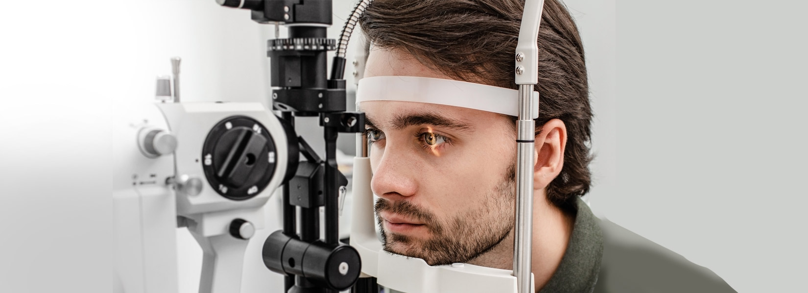 young man during eye exam in St. Louis Hills